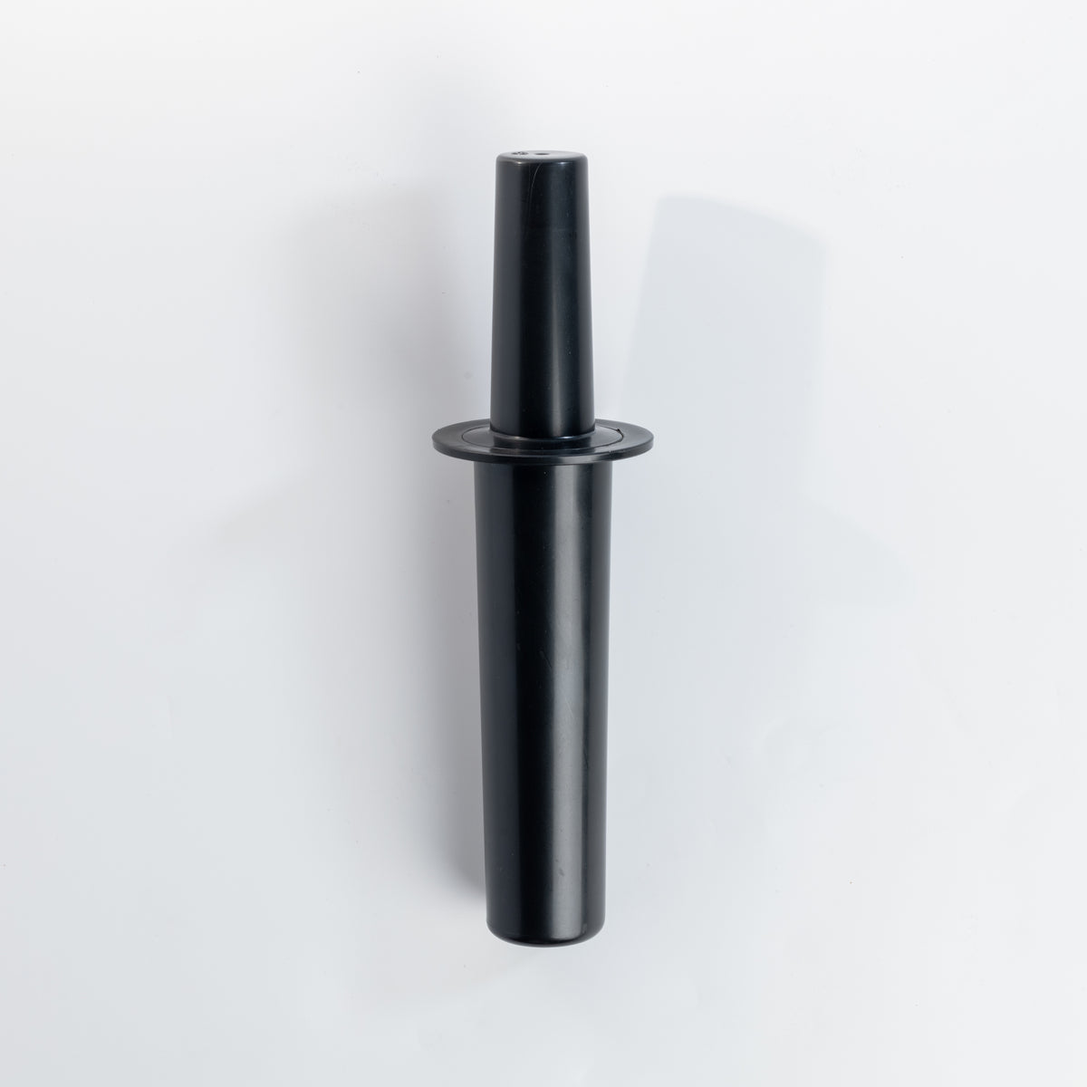 The black VOID tamper standing upright on a white background